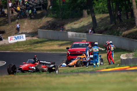 IndyCar champ Will Power shoves Scott Dixon after crash during practice for Road America